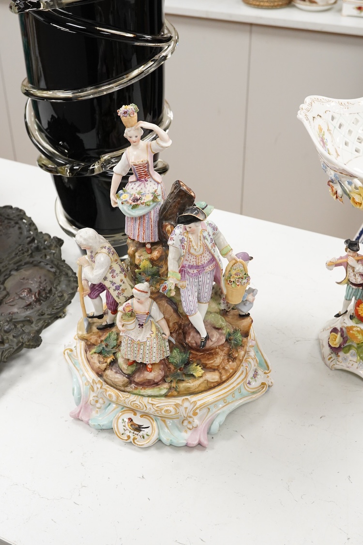 A pair of German porcelain figure groups, late 19th century and a Dresden centrepiece bowl-29cm high